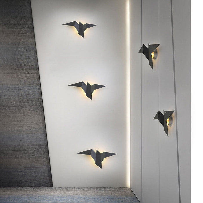 Kreative Wandleuchte aus Eisen in Vogelform-Leuchtezauber