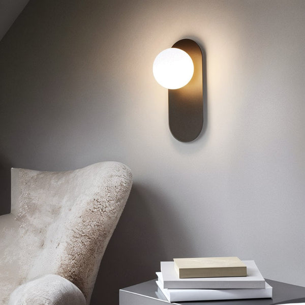 Wandleuchte für das Schlafzimmer aus Metall und Glas-Leuchtezauber